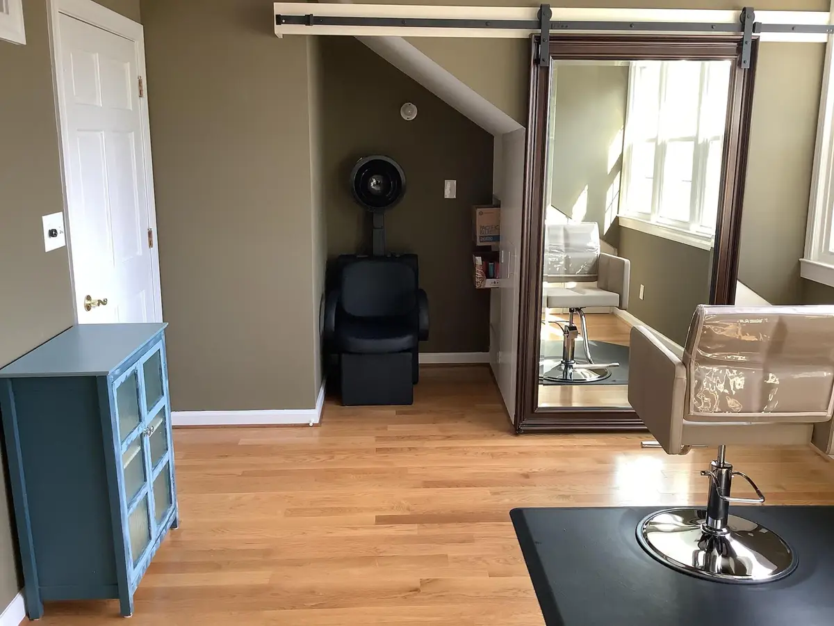 The salon chair and mirror.