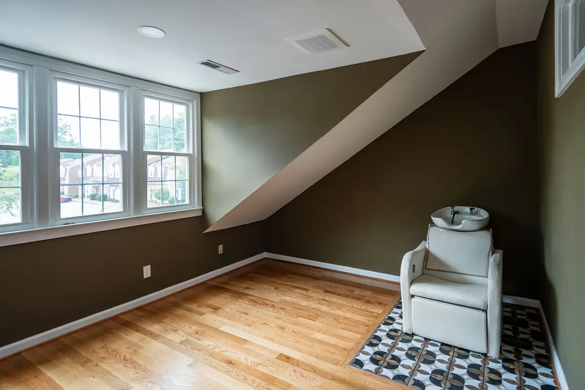 The upstairs room from the window side, with daylight over the street.